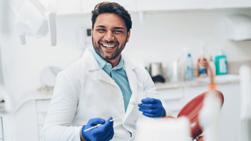 dentist-smiling-at-patient